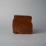Base view of KODAMA Nashiji, showing the diagonal end-grain pattern of the aged wood.