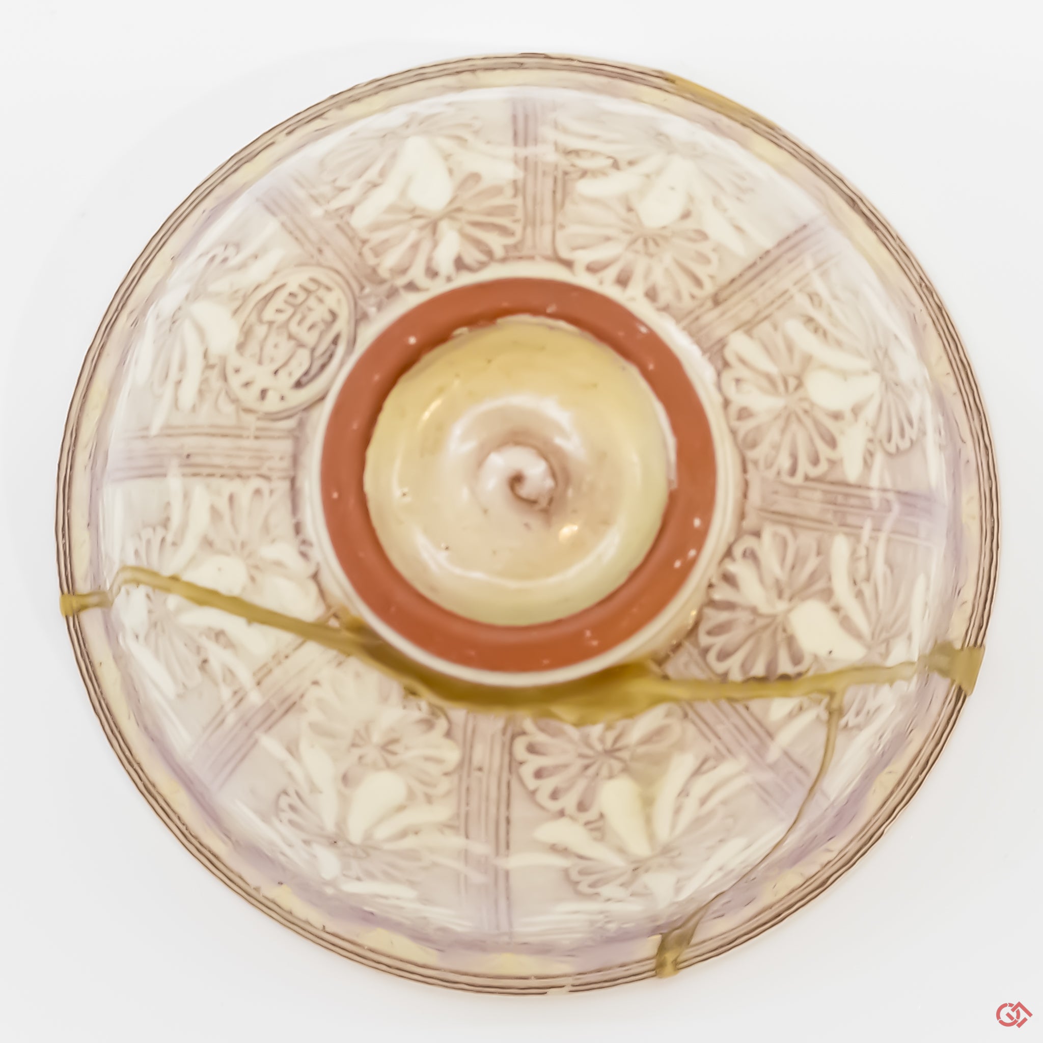 Photo of the bottom side of an authentic Kintsugi pottery piece, showing its overall design and features