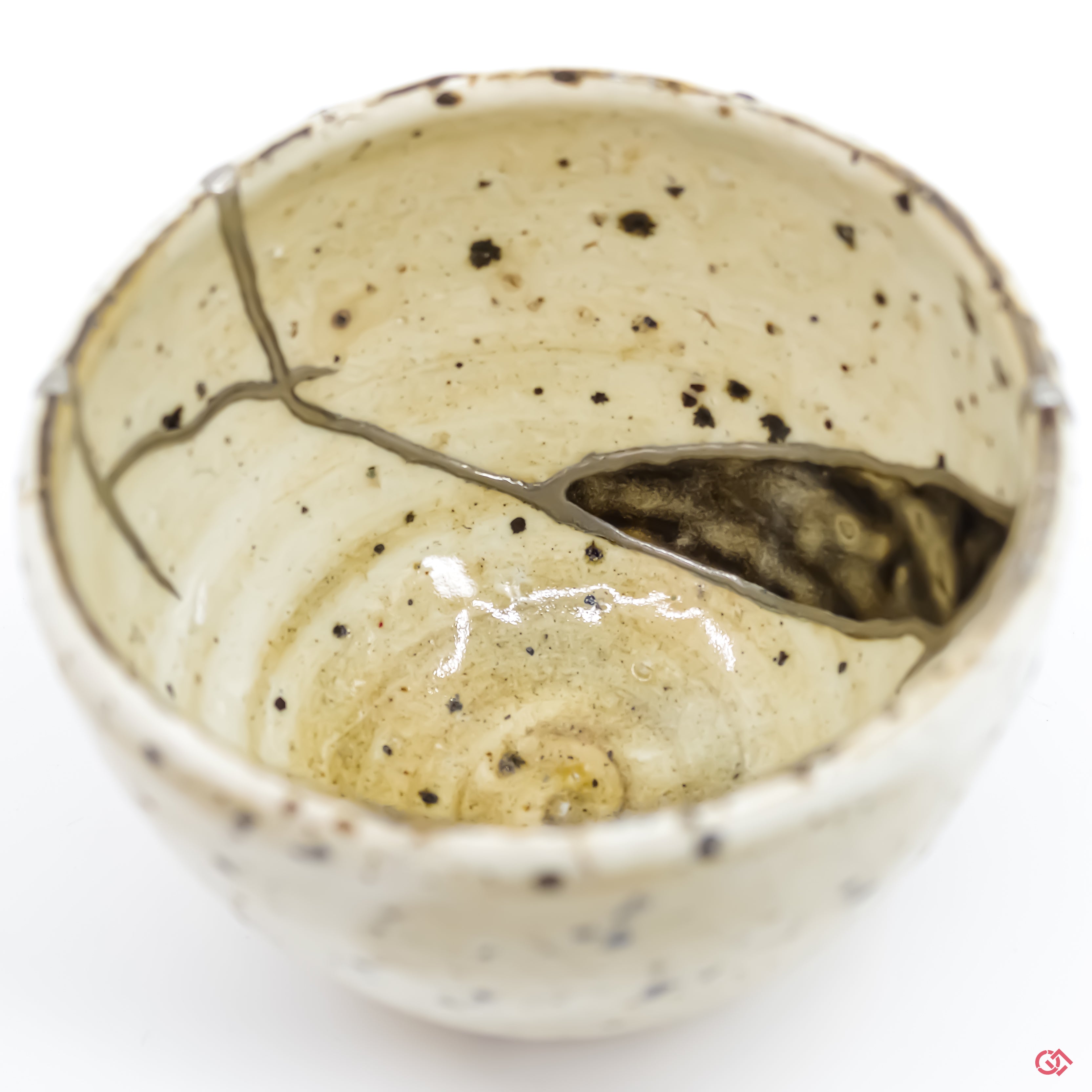 Appreciate the artistry of Kintsugi: Detailed image of pure silver-filled cracks in pottery.