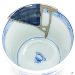 Up-close look at authentic Kintsugi pottery, highlighting intricate details.
