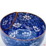 Buy the Japanese art of Kintsugi up close: Witness the delicate brushstrokes of gold that transform imperfection into beauty.