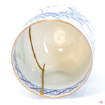 Close-up photo of an authentic Kintsugi pottery, showing the detail of its repairs and craftsmanship