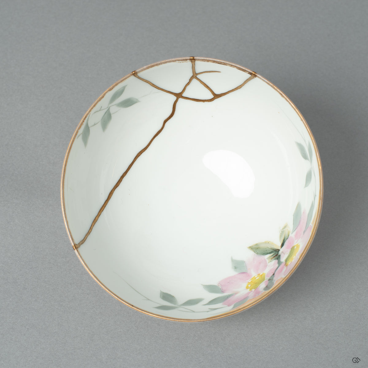 Top-down view into the Early Noritake kintsugi cup, its golden seams offering a moment of contemplation' on the beauty of a second life.