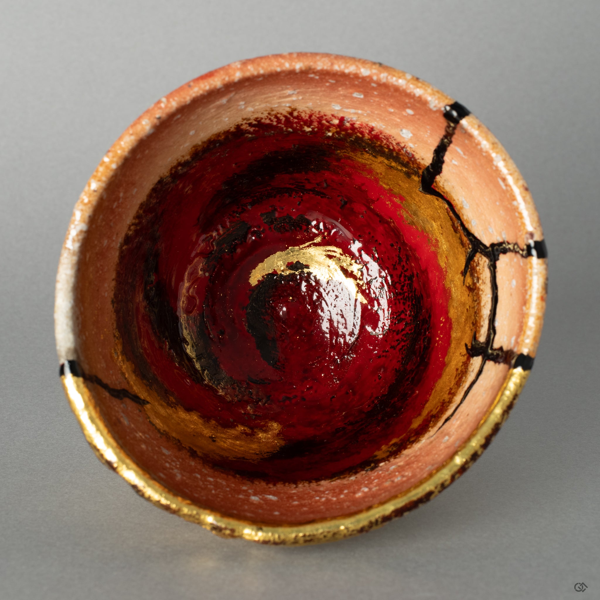 Top-down view into the Shigaraki kintsugi cup, its restored interior landscape offering a moment of contemplation on the beauty of imperfection.