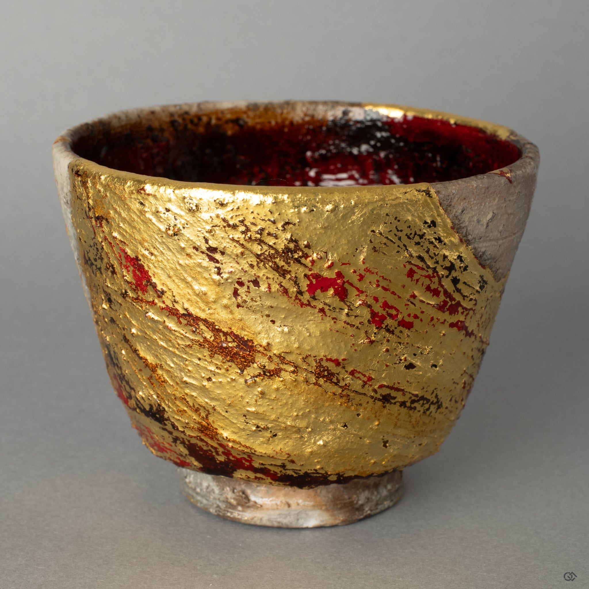 A close-up of a golden kintsugi line on this unique Shigaraki cup, telling a silent story in every seam of its thoughtful restoration.