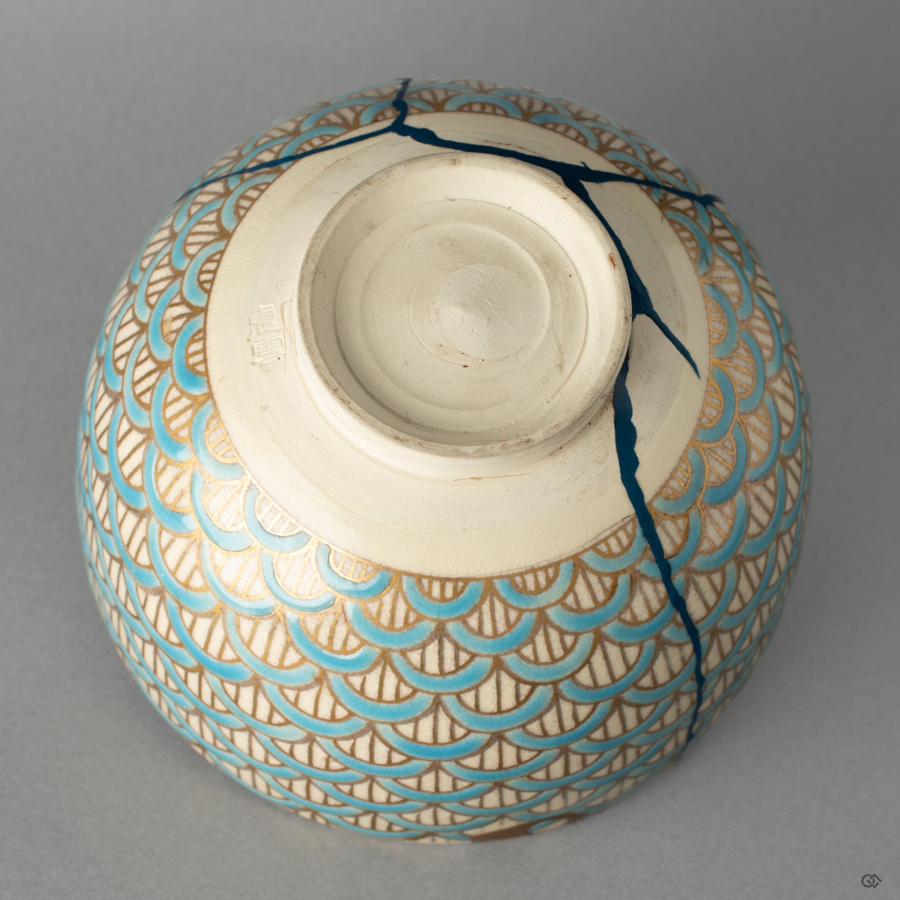 Bottom view of the Kyoto ware matcha bowl, revealing its heritage and the artisans mark—a tangible piece of Japanese philosophy.