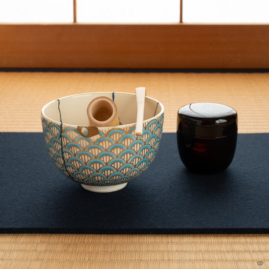 Authentic kintsugi matcha bowl in a Japanese tea room setting, crafted with urushi lacquer and 24K gold, evoking wabi-sabi, contemplation, and intentional living.