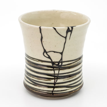 Authentic kintsugi Arita ware tea cup with distinctive blackish layers glaze and 24K gold repair — a masterpiece of Japanese craftsmanship praised by a verified buyer from Quebec Canada.