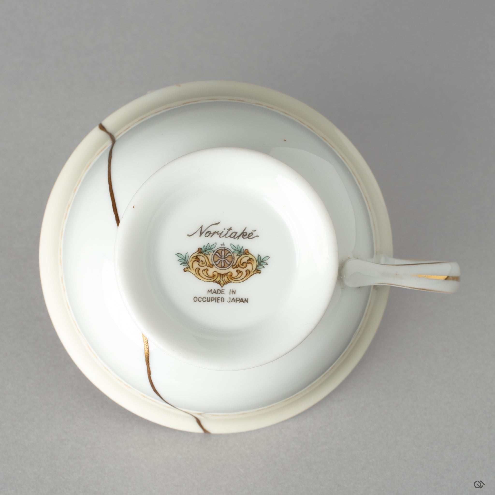 The base of the Early Noritake cup, where the kintsugi repair meets the makers mark, honoring authentic Japanese craftsmanship.