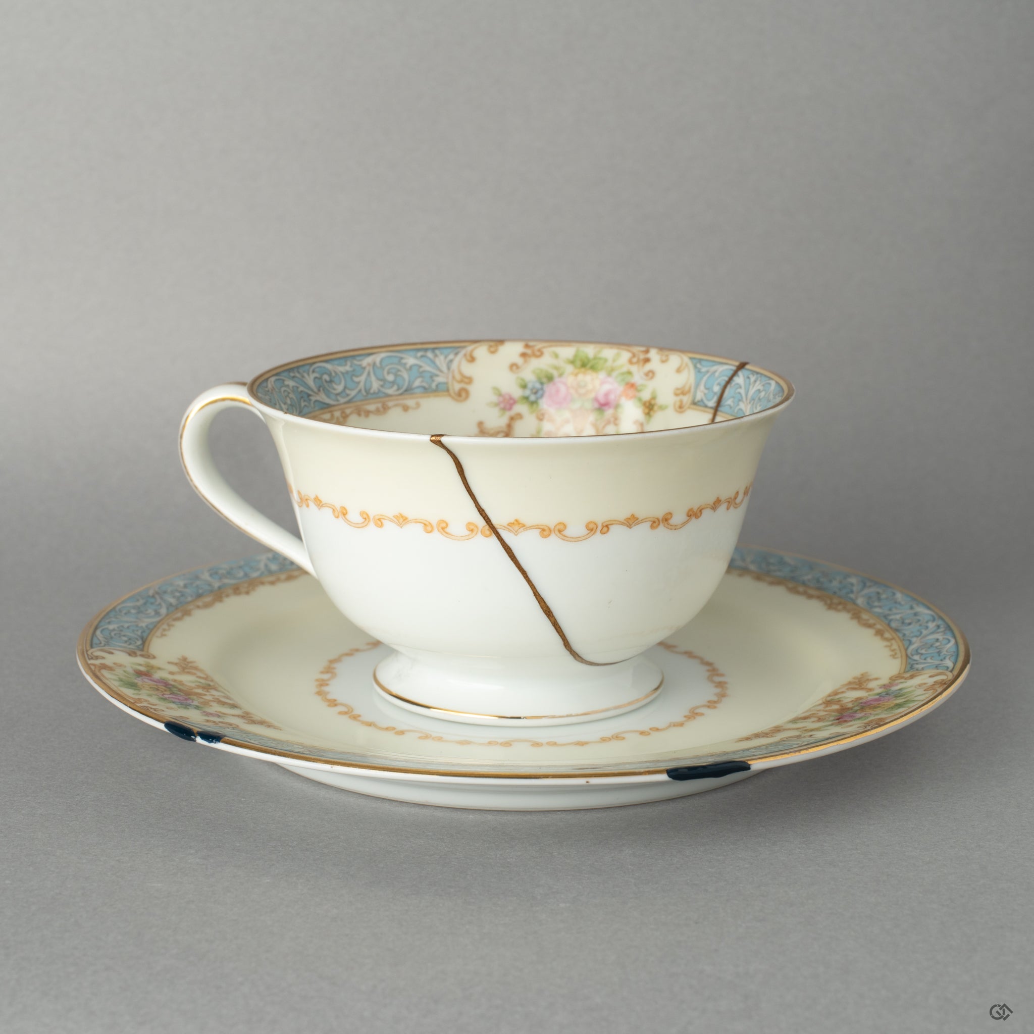 Front view of an Early Noritake kintsugi cup and saucer, renewed with 24K gold, giving this vintage set a new story to tell.