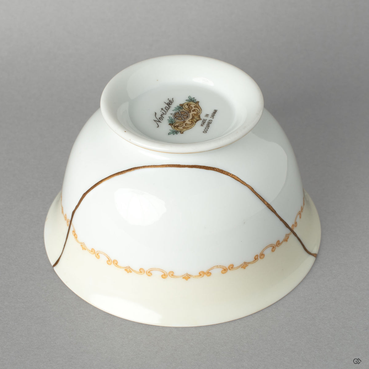 Side profile of the Noritake cup, its delicate kintsugi line a profound vision of resilience made beautiful.