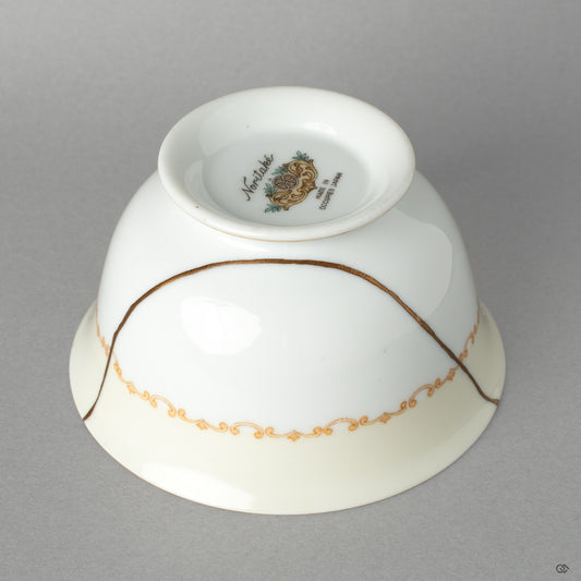 Side profile of the Noritake cup, its delicate kintsugi line a profound vision of resilience made beautiful.