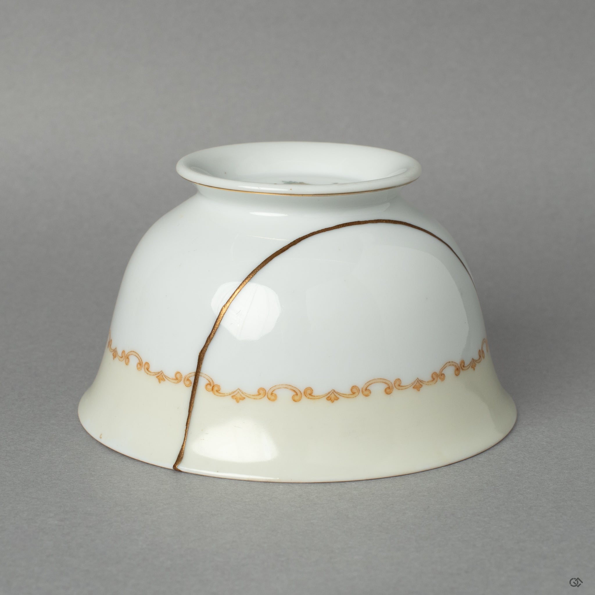 A different side view of the Early Noritake cup, its graceful kintsugi mend an act of honoring history and its journey through time.