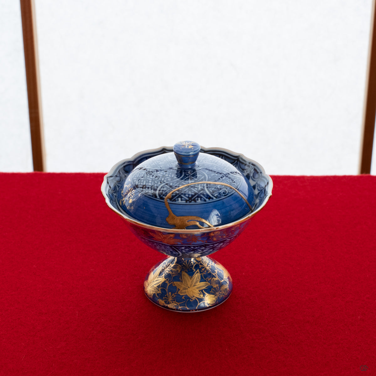 A Kyoto ware kintsugi lidded cup resting on a tatami mat, its 24K gold repair glowing softly, a perfect vessel for intentional living.