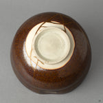 The base of a Kyoto ware matcha bowl, where the kintsugi repair meets the potters mark, honoring true Japanese craftsmanship.