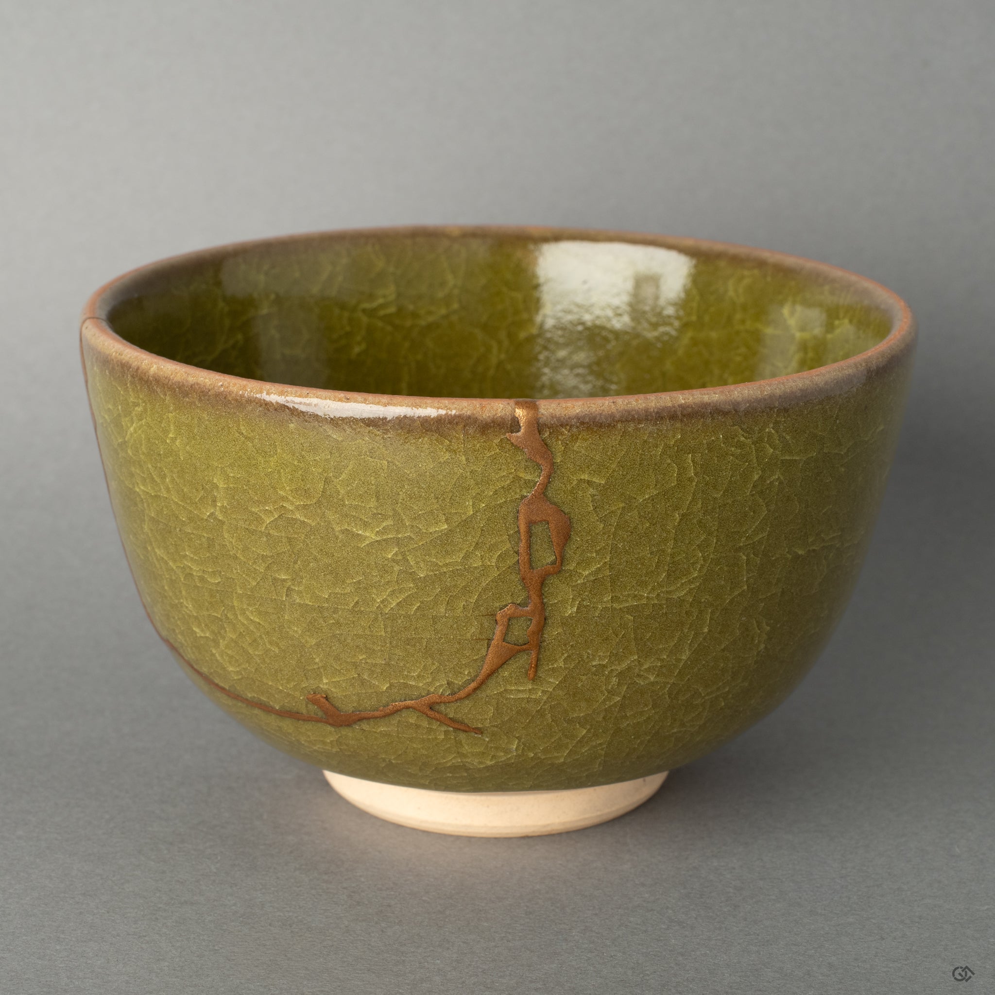 Front view of a Kyoto ware matcha bowl, its form renewed with 24K gold kintsugi, giving this treasured piece a new story to tell.