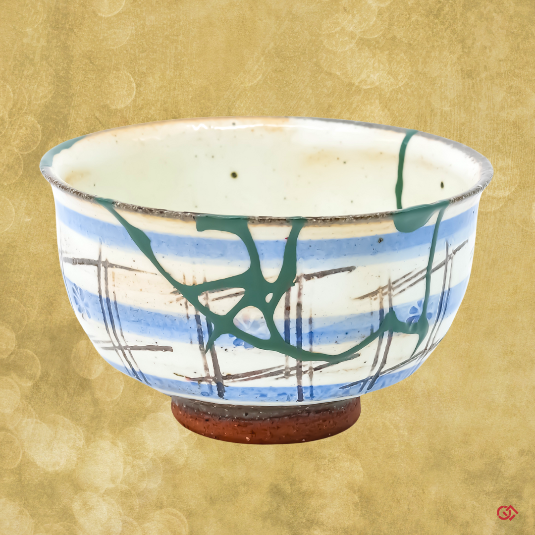 Authentic Japanese Kintsugi: Broken pottery restored with colored urushi lacquer, embodying Wabi-Sabi philosophy.