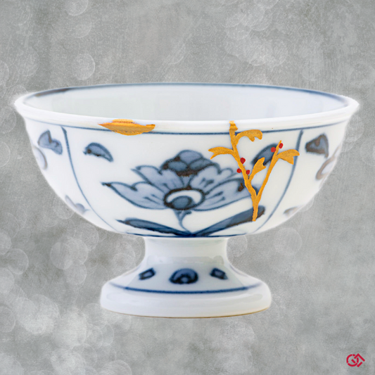 Full-color image of an authentic Kintsugi pottery piece, showing its intricate repairs and unique design