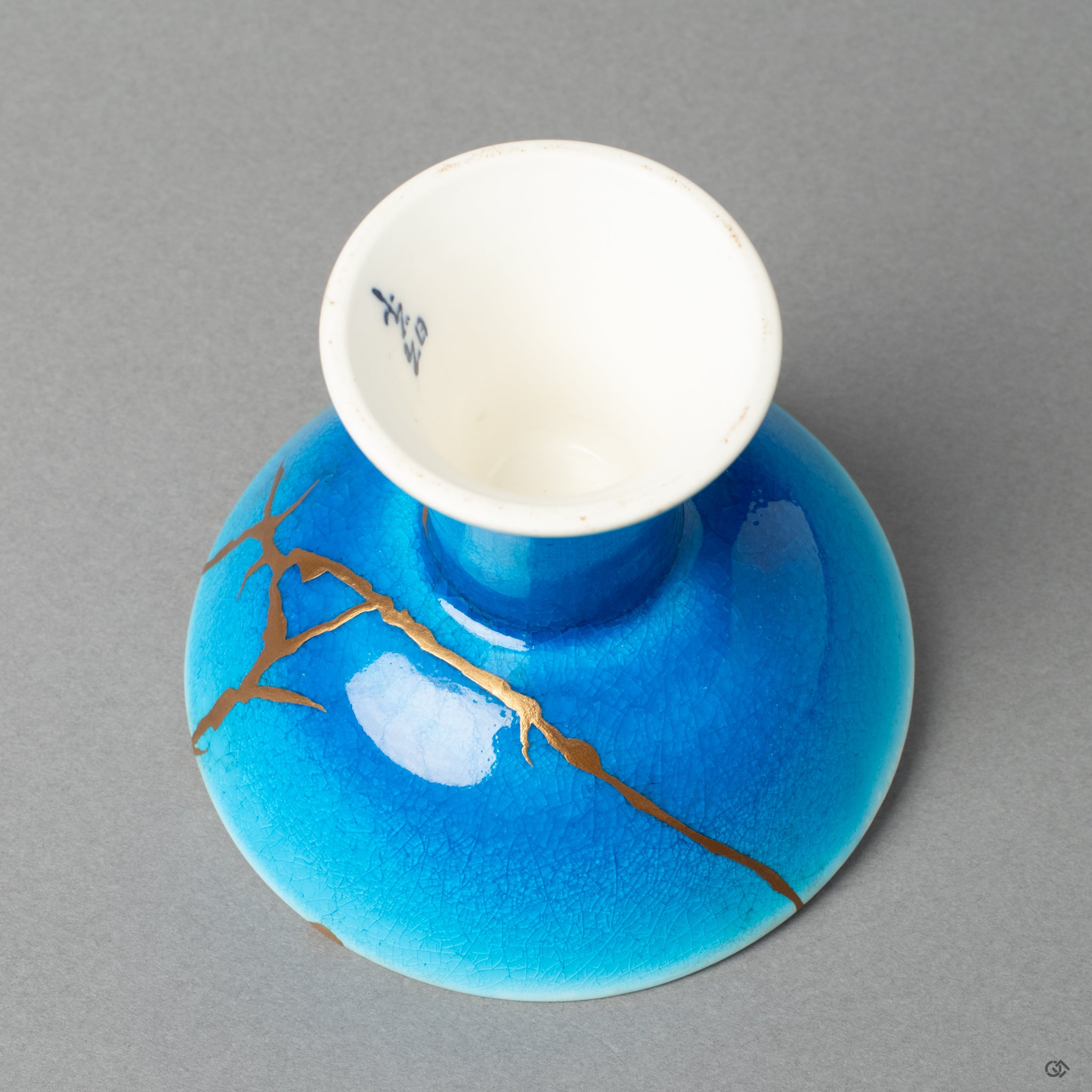A detailed view of the kintsugi repair, highlighting the grace in flaws and a new story to tell.