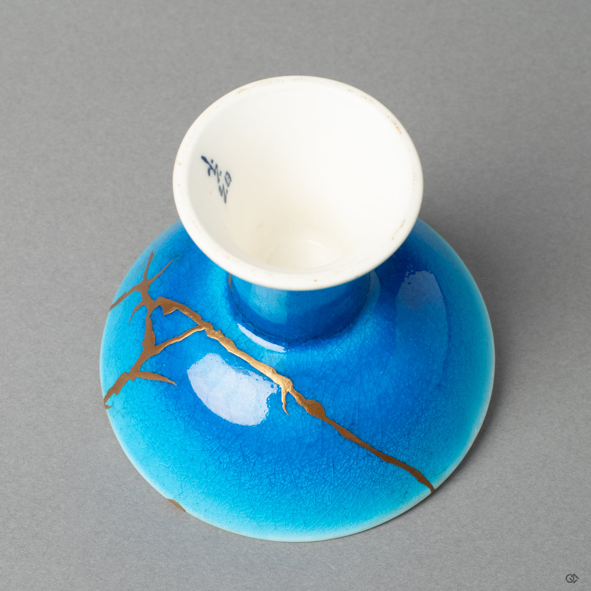 A detailed view of the kintsugi repair, highlighting the grace in flaws and a new story to tell.