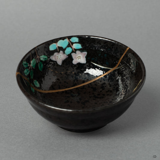Front view of an Arita ware sake cup, reborn through 24K gold kintsugi that gives this porcelain vessel a new story to tell.