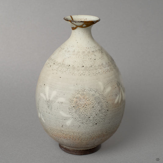 Front view of a Kyoto ware tokkuri, reborn through 24K gold kintsugi that gives this treasured heirloom a new story to tell.