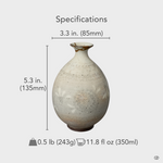 A size-reference view of the Kyoto ware tokkuri, its elegant and balanced proportions a physical embodiment of philosophy in form.