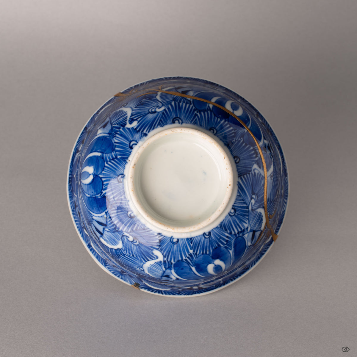 Bottom of a Ko-Imari kintsugi bowl showing the unglazed foot ring and maker marks, authentic Japanese kintsugi.