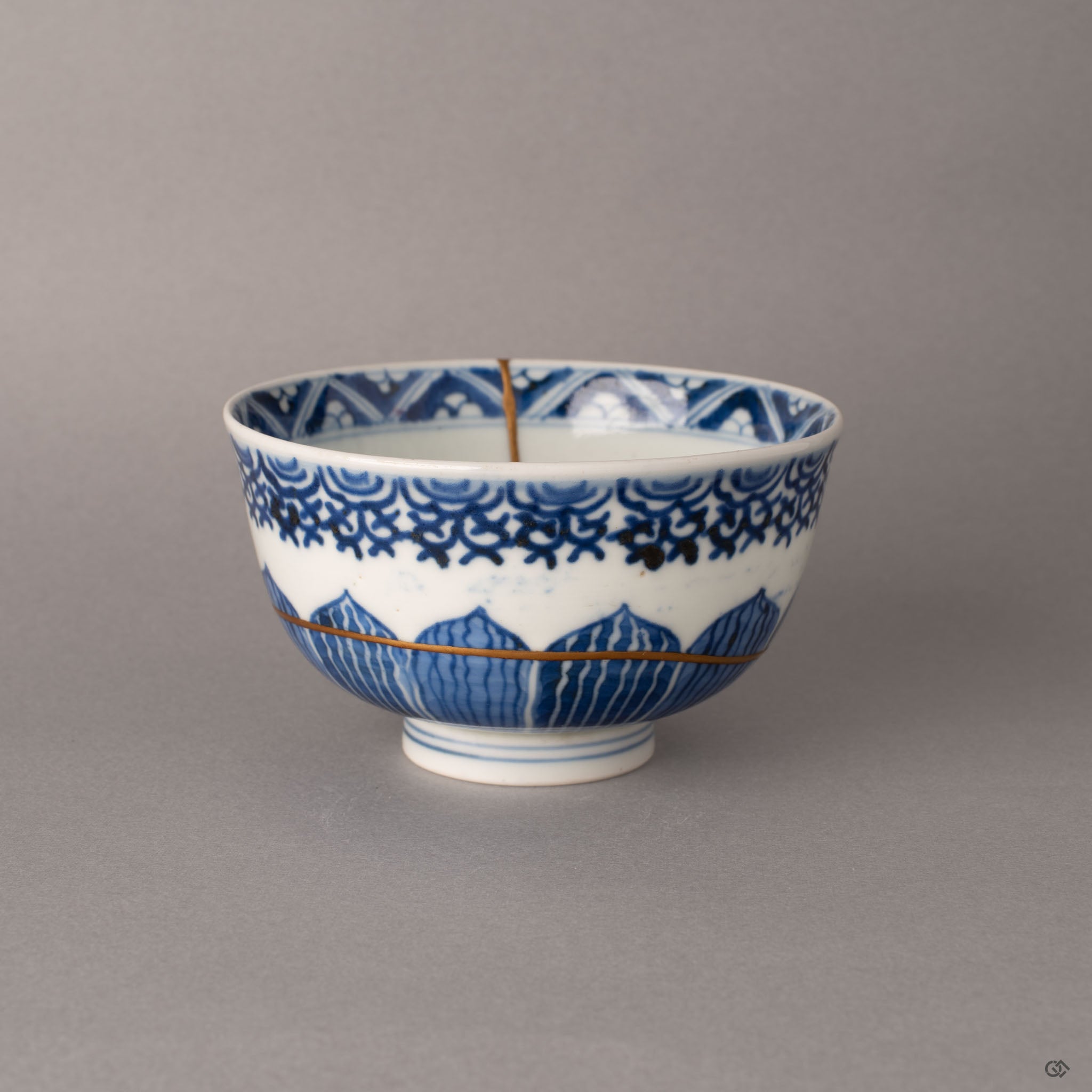 Alternate side of kintsugi Ko-Imari bowl revealing the continuation of gold seams through layered sometsuke bands, enduring legacy in porcelain.