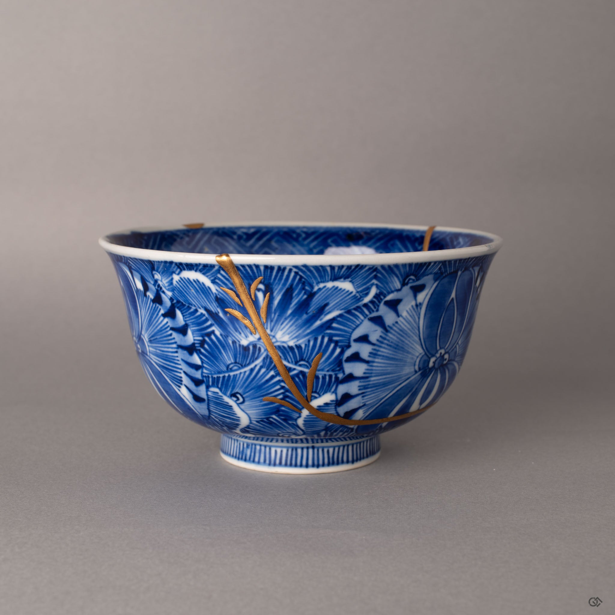 Gold maki-e branches on kintsugi seams of a Ko-Imari bowl, urushi lacquer art alongside cobalt sometsuke painting, heritage luxury.