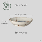 Kintsugi Ko-Imari bowl with diameter, height, and weight overlaid on its front view; a single gold seam crosses the cobalt landscape, one of a kind.