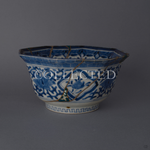Octagonal Ko-Imari bowl in blue-and-white sometsuke, its lost shards filled with green urushi and raden and edged in 24K gold kintsugi, with pure silver seams, shown from the front. Sold out.