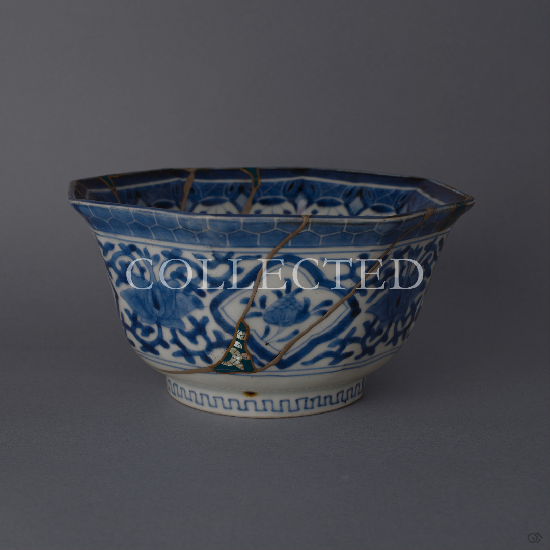 Octagonal Ko-Imari bowl in blue-and-white sometsuke, its lost shards filled with green urushi and raden and edged in 24K gold kintsugi, with pure silver seams, shown from the front. Sold out.