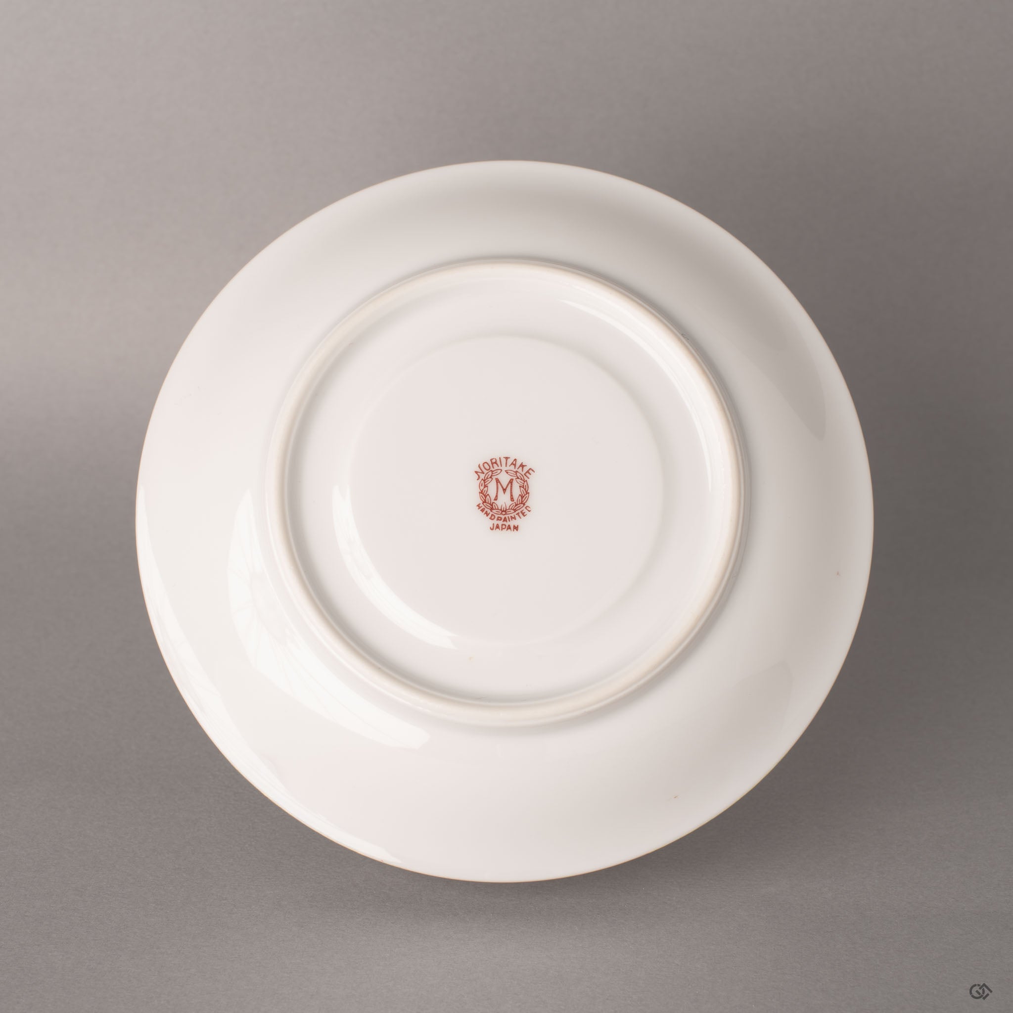 The Noritake backstamp authenticates this kintsugi porcelain, heritage marked beneath the restored saucer.