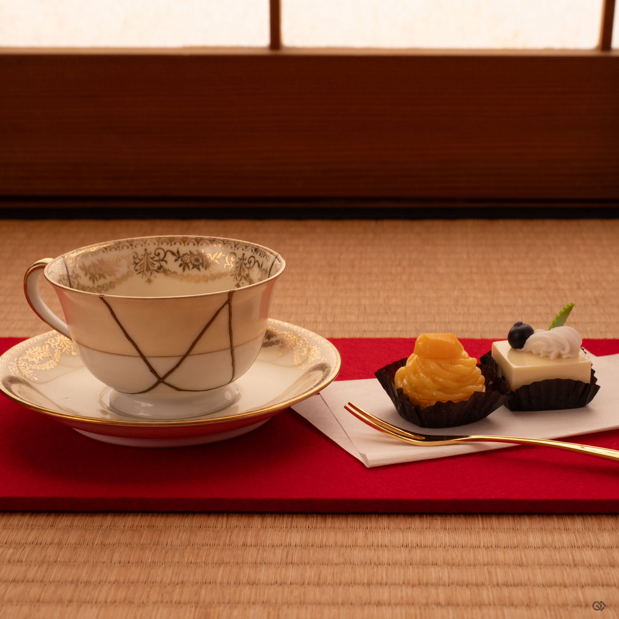 Early Noritake kintsugi cup rests on tatami, gold seams glowing softly—tea as philosophy made tangible.