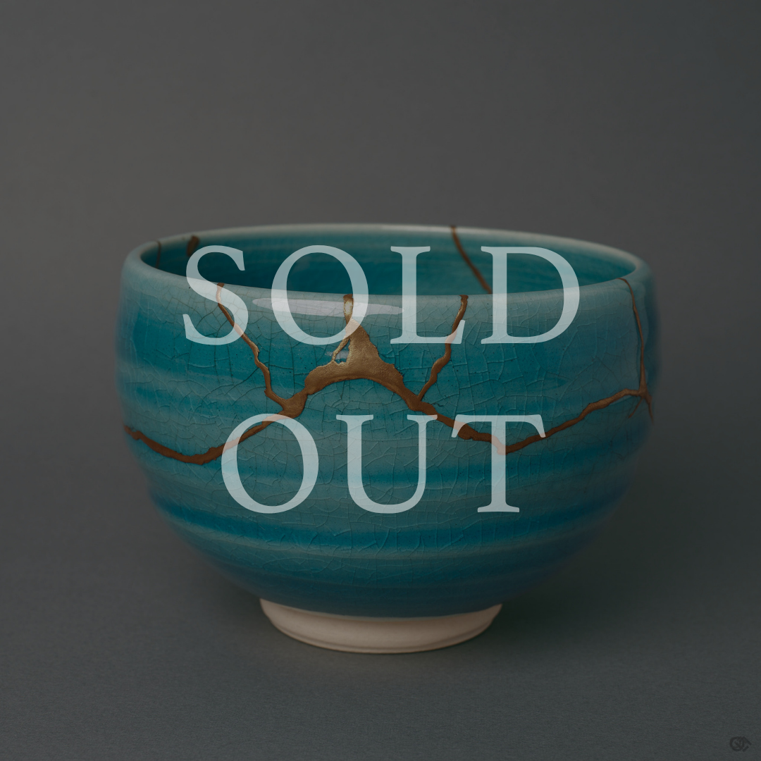Sold out: kintsugi Kyoto ware matcha bowl in turquoise crackle glaze with 24K gold seams crossing the rounded body.