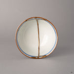 Top view of kintsugi Ko-Imari cup with gold lines radiating across the rim and interior, food-safe urushi craftsmanship from above.