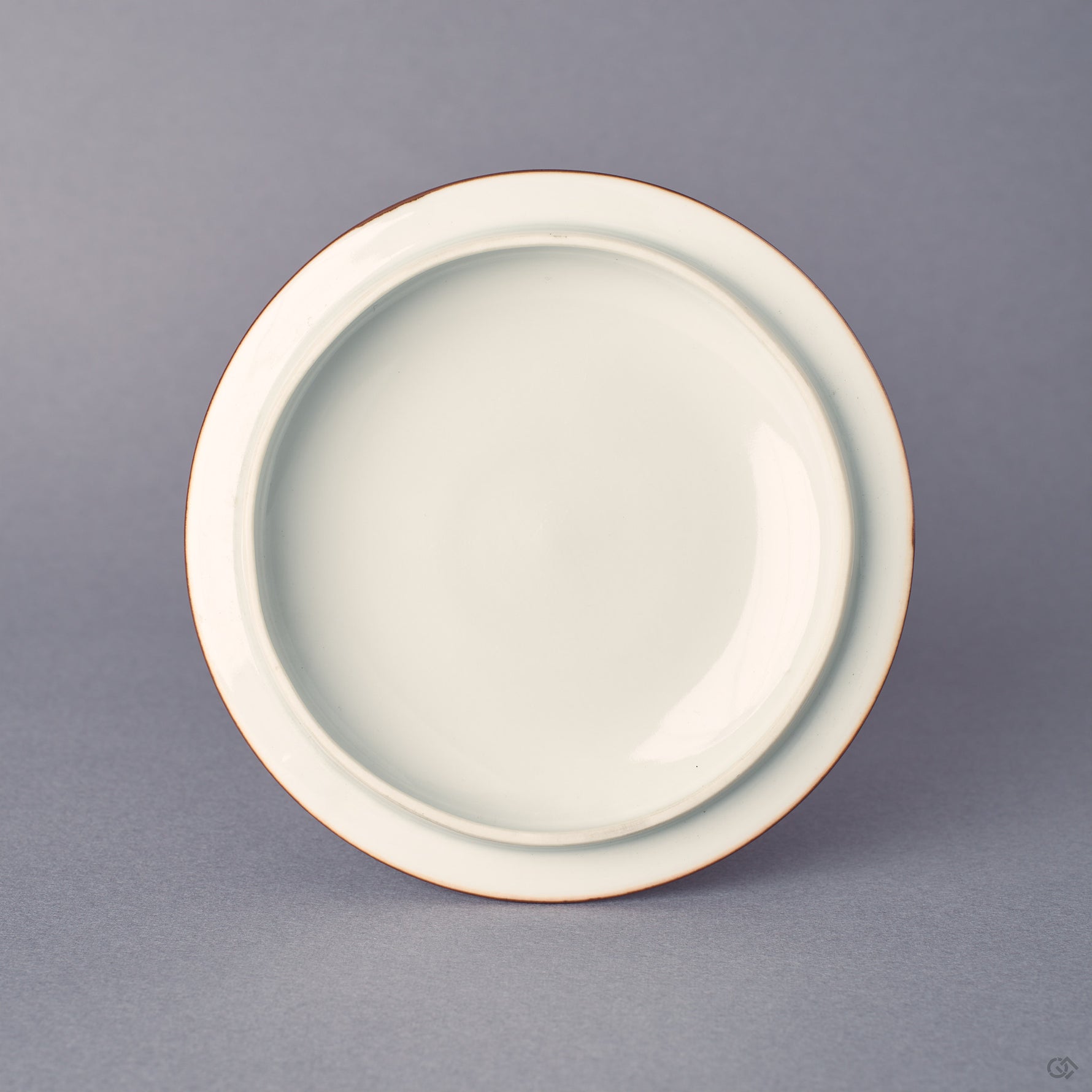Underside of the Kyoto ware cup lid, white porcelain with sometsuke blue edge, fitted profile, gold-banded rim from the 24K gold kintsugi work.