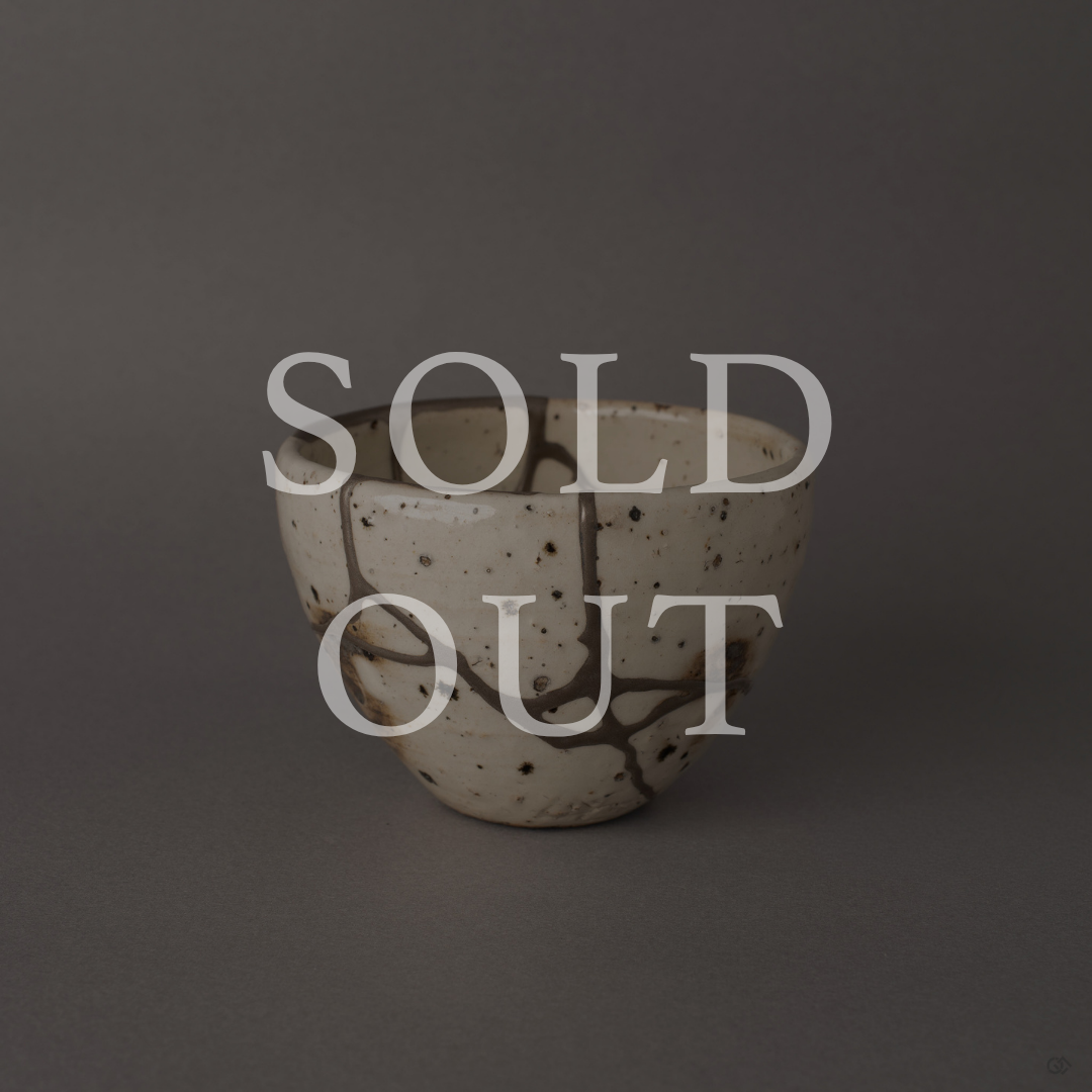 Sold out: Silver kintsugi Shigaraki earthenware cup with branching silver seams on ivory white surface