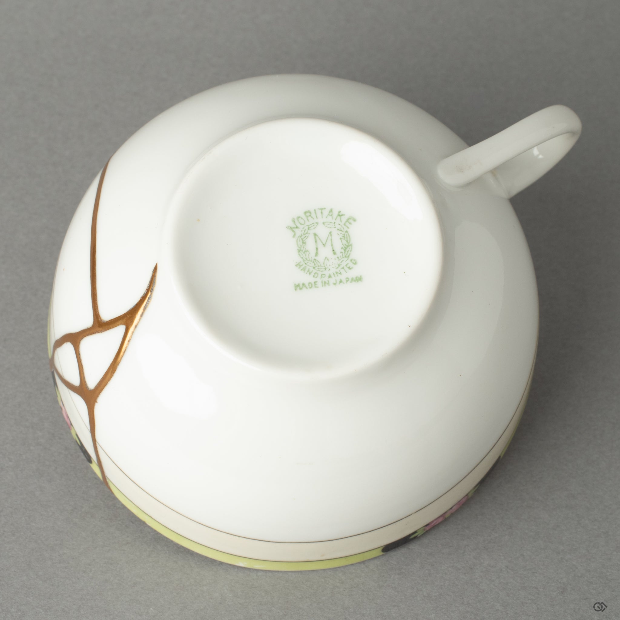 Bottom view of an antique kintsugi cup, where hidden beauty is revealed—an homage to history made visible through urushi artistry.