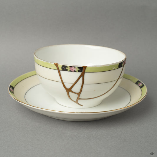 Front view of a Noritake kintsugi cup and saucer, restored with 24K gold—an enduring symbol of resilience made beautiful.