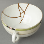 Interior close-up of a kintsugi cup’s golden seam—inviting a moment of contemplation within its quiet, tactile history.