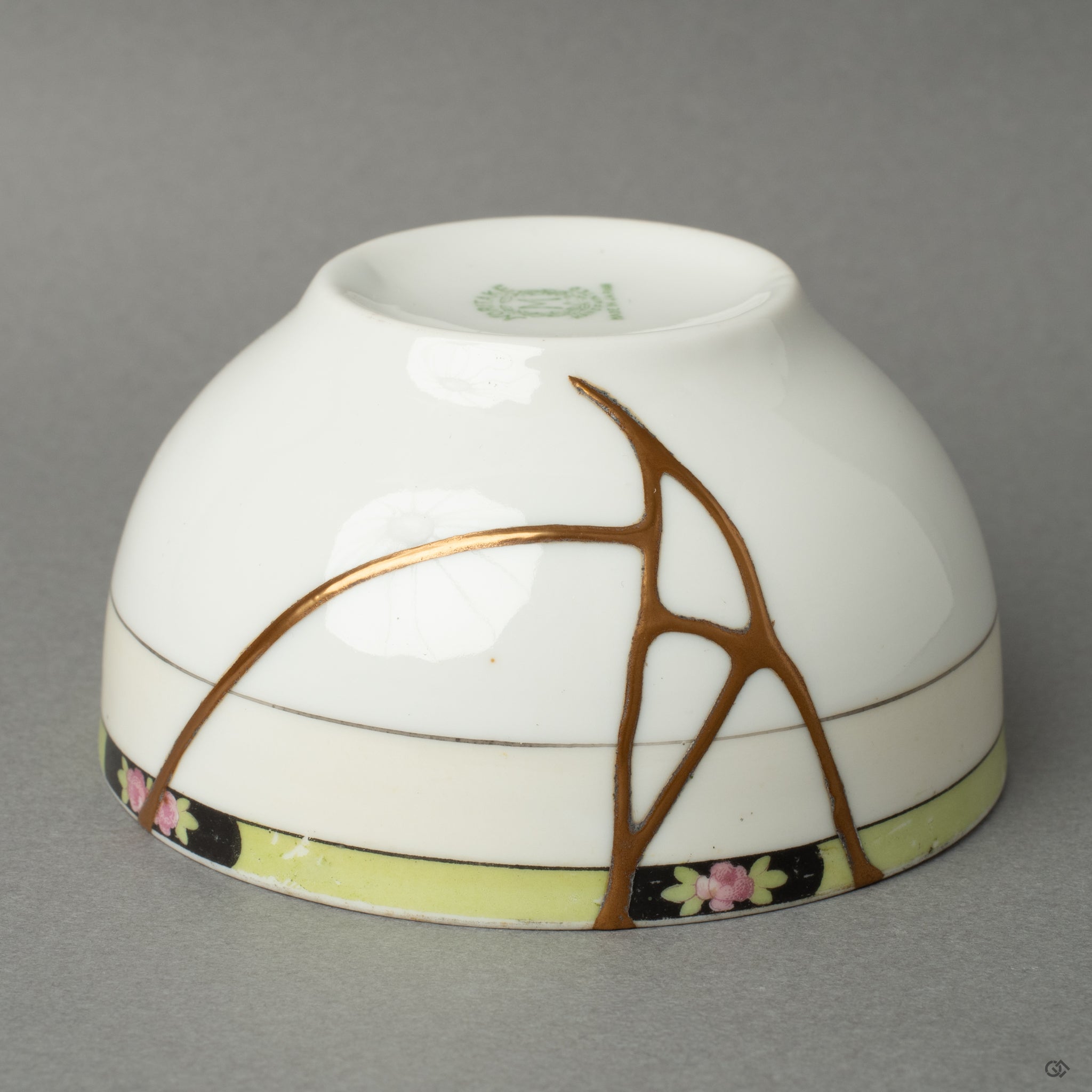 Side profile of a Noritake kintsugi cup with 24K gold veins—expressing grace in flaws and timeless Japanese elegance.