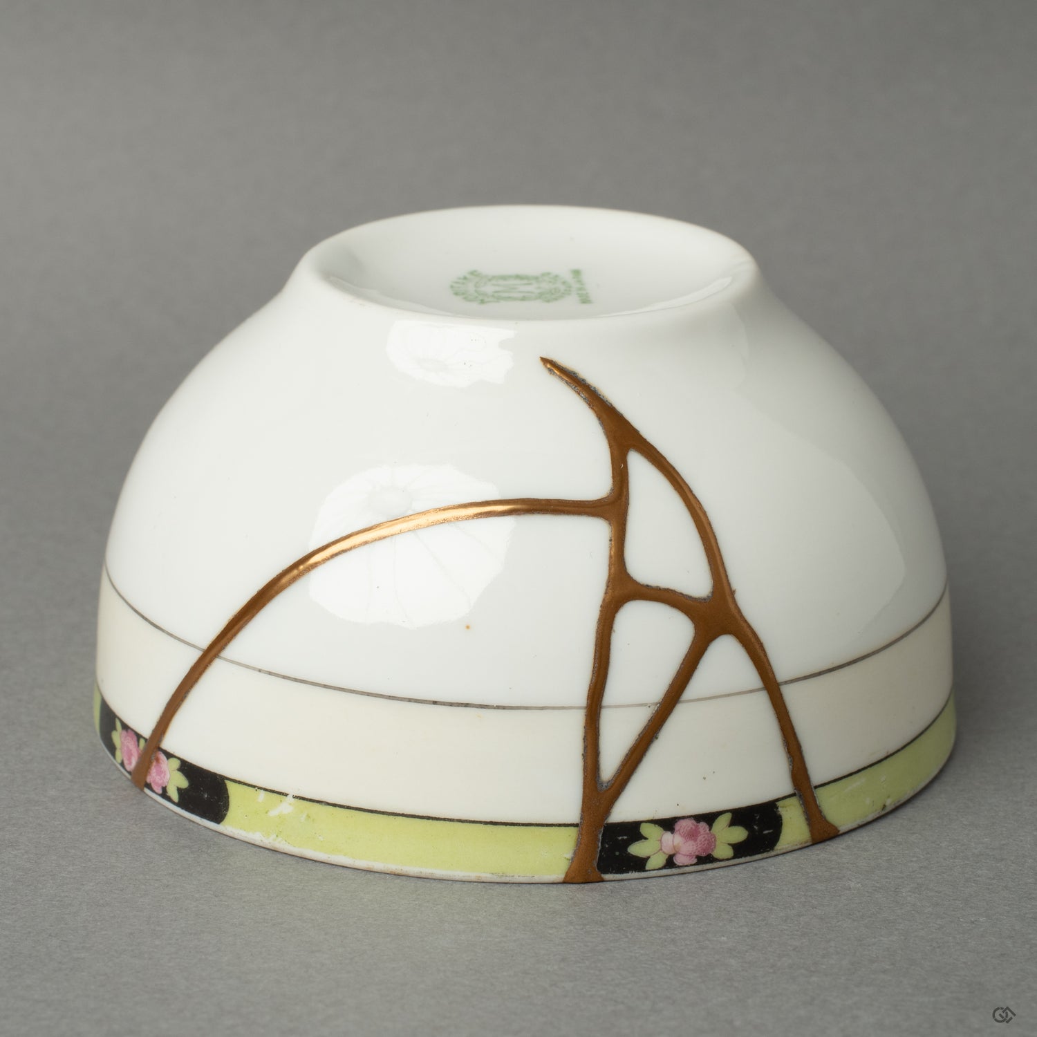 Side profile of a Noritake kintsugi cup with 24K gold veins—expressing grace in flaws and timeless Japanese elegance.