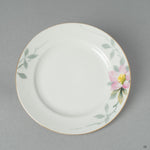 The original, unbroken surface of the Early Noritake saucer, its flawless vintage glaze a study in the elegance of a quiet beauty.