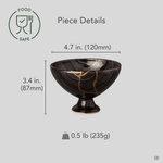 Arita ware footed bowl in black porcelain with 24K gold kintsugi seams, restored with natural urushi, shown beside measurements for scale reference: 4.7 in wide, 3.4 in tall.