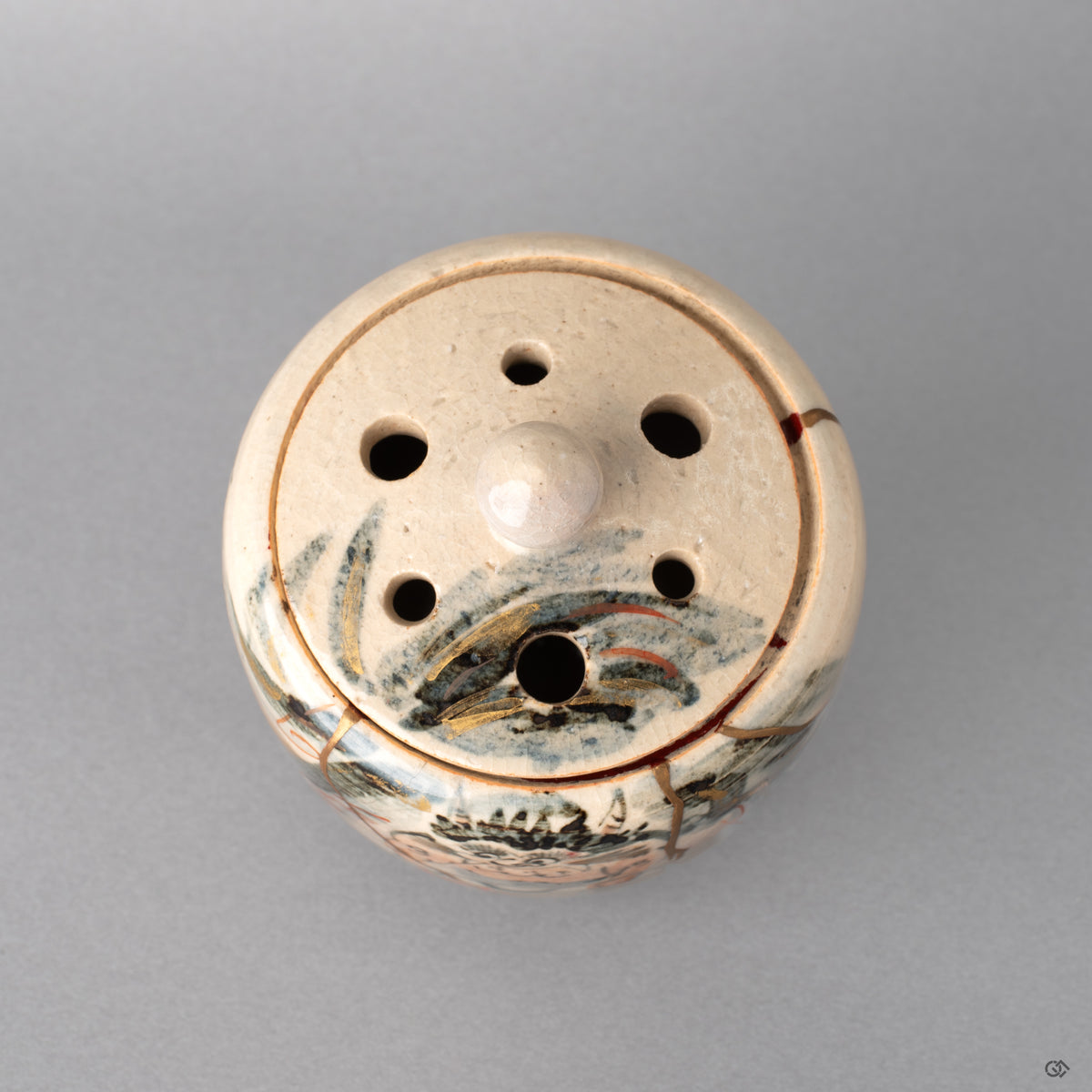 Top view of the kintsugi incense burner. Gold seams trace patterns celebrating beauty in imperfection.