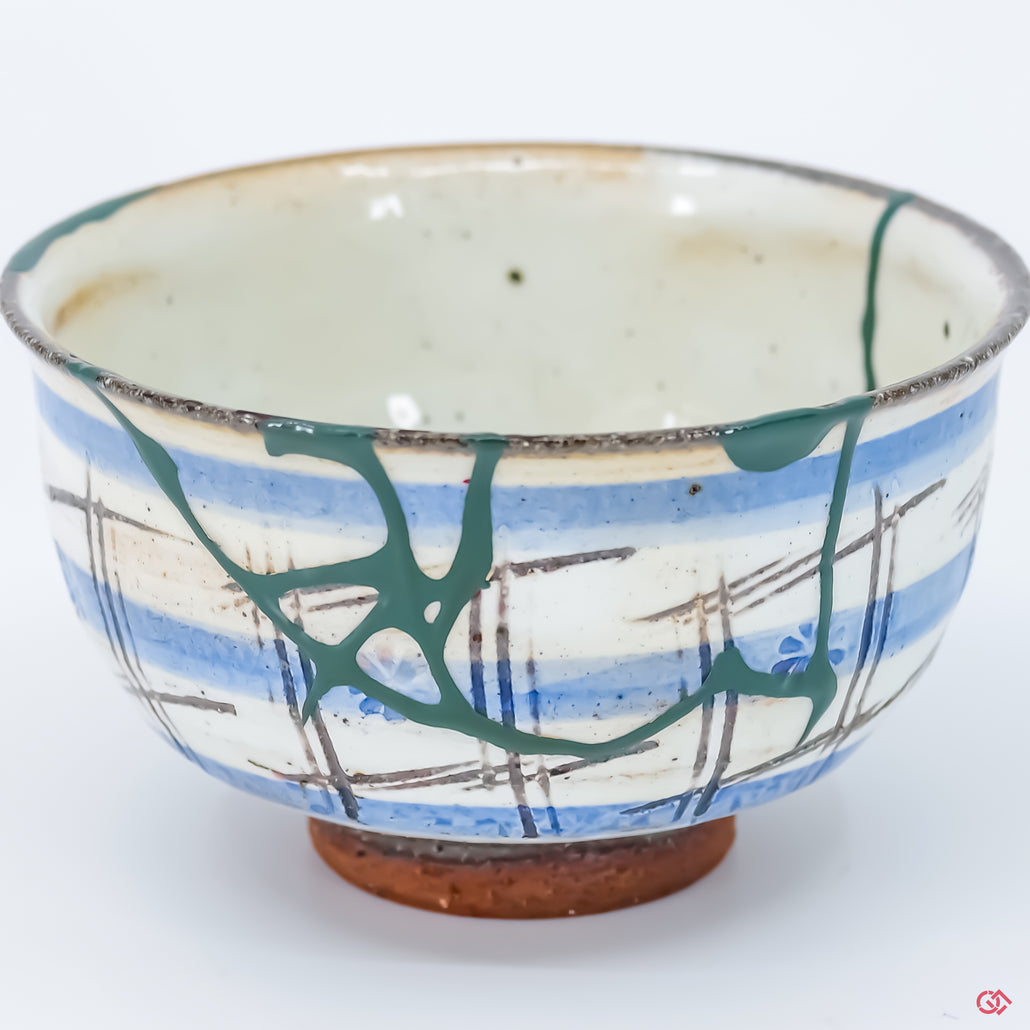 Discover the beauty of Kintsugi: Close-up of hand-repaired pottery