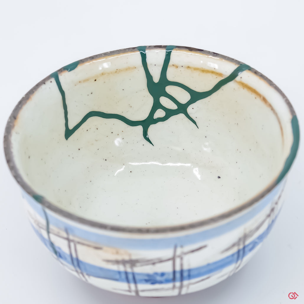 Discover the beauty of Kintsugi: Close-up of hand-repaired pottery.