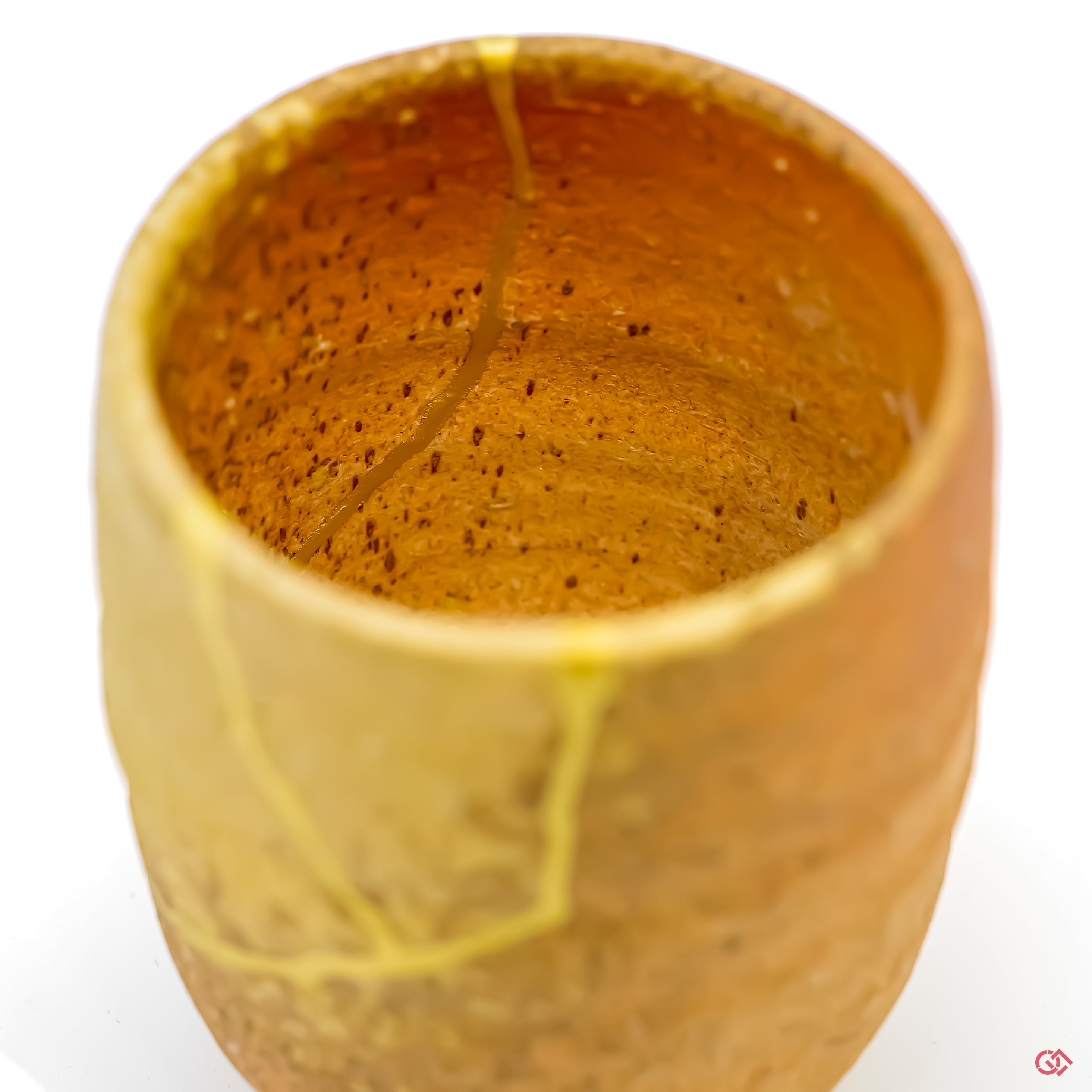 Japanese art of Kintsugi up close: Witness the delicate brushstrokes of gold that transform imperfection into beauty.